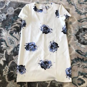 White dress with blue and black flowers